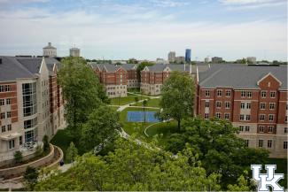 Overhead view of dorms on campus with a basketball court in the middle.
